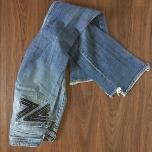 Seven jeans. The bottom back of the jeans are worn